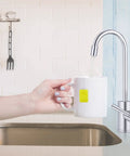 Instant On Demand Hot Water Dispenser System With 2.5 Quart Tank in use, manual temperature control, brushed nickel finish