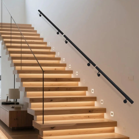 Upgrade Your Stairs With This Rock Solid Stainless Steel Wall Mount Handrail on modern wooden staircase with lights.