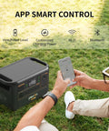 Person controls Beefy F3000LFP 3072Wh Portable Power Station With 3600W Pure Sine Wave LiFePO4 Battery Backup via smartphone app outdoors.