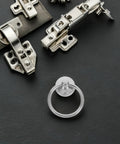 Close-up of Vintage Metal Ring Drawer Pulls Ten Pack Silver Cabinet Handles with round drop knob and installation hardware.