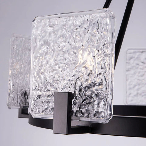 Close-up of textured glass shade on 5 Light Black Farmhouse Chandelier for Dining Room and Foyer, Go-To Rustic Round Wagon Wheel Pendant