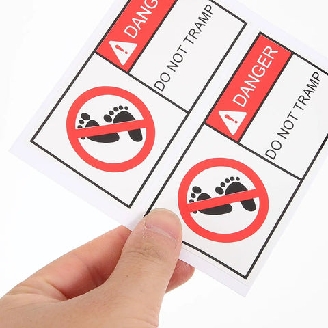 Hand holding Self Adhesive Warning Sign Stickers PVC Material 2 Pack with DO NOT TRAMP caution