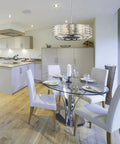 Hand Cut Crystal Drum Fandelier Ceiling Fan With Remote, Polished Chrome Frame over modern dining table in bright kitchen.