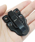 Four Pack Retro Black Box Toggle Latch With Padlock Hole in hand, antique brass finish, heavy-duty iron, ideal for jewelry boxes and cabinets.