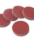 Premium 5 Inch Hook And Loop Sanding Discs With Durable Aluminum Oxide abrasive For Heavy Duty Wood Metal Work In 60 To 1000 Grits stacked in a pile.