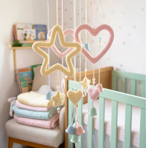 Aluminum Craft Wire and Acrylic Yarn Kit for I Cord Knitting Beginners Includes Eight 25 Gram Yarn Skeins and Two Rolls of Five Meters by Three Millimeter Wire for Easy DIY Handicraft Projects featuring baby mobile with knitted stars and hearts in pastel colors.