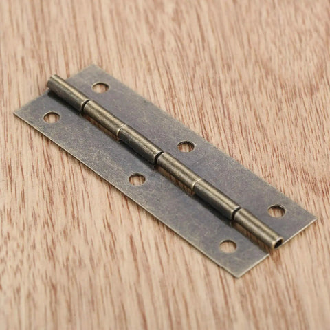 Antique Bronze Decorative Hinges Set For Wood Box And Cabinet 4 Pack 60 By 20mm Butt Hinge close-up on wooden surface