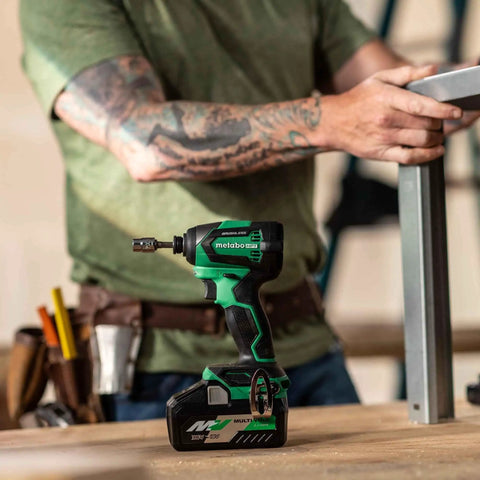 18V MultiVolt Cordless Brushless Impact Driver And 18 Gauge Brad Nailer Combo Kit for framing in use on workbench