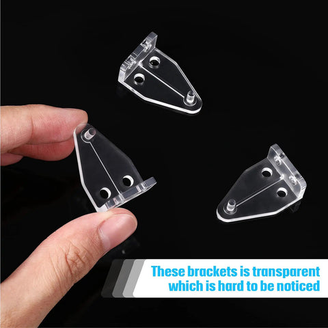 Crystal Clear Window Blind Hold Down Brackets No Sweat Mini Plastic Tension Clips For Roller Shades And Blinds Quick Setup set of three clips in hand on black background.