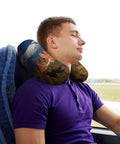 Man using Pikes Peak Colorado Travel Pillow U Shaped Neck Support for Long Haul Flights and Office Naps on bus seat.