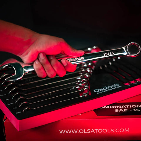 Hand holding 15/16 wrench from 15 Piece SAE Combination Wrench Set Built From Chrome Vanadium Steel With Precision 12 Point Box End
