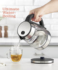 Fast Boil Electric Kettle For Coffee And Tea 1.7L Water Boiler 1500W Borosilicate Glass pouring water into a cup on a kitchen counter.