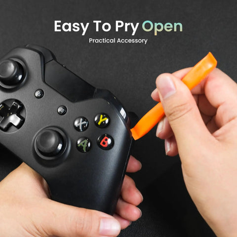 Top Shelf 32 Piece Precision Screwdriver Set With S2 Steel Bits And Lightweight Aluminum Handle Built To Nail Quick Repairs On MacBooks Laptops Watches And Gaming Consoles Portable Edc Tool Kit, prying open a game controller.