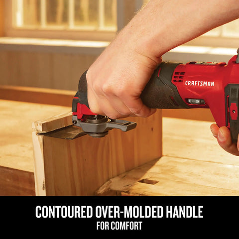 Close-up of Cordless Oscillating Tool Kit with Blades, Sandpaper, Battery and Charger Included being used on wood