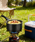 1.5 Quart Nonstick Saucepan With Detachable Handle And Swiss Granite Coating cooking outdoors on a camping stove
