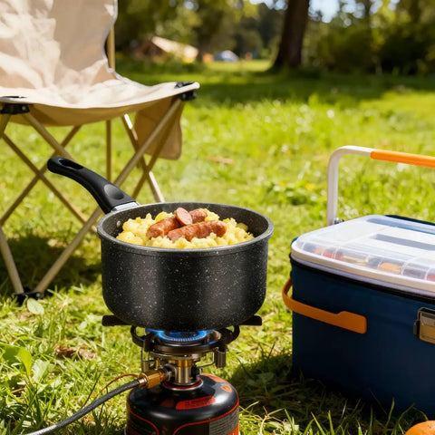 1.5 Quart Nonstick Saucepan With Detachable Handle And Swiss Granite Coating cooking outdoors on a camping stove