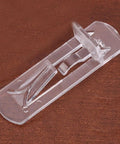 Transparent Shelf Clips Set For Cabinets And Bookshelves With Locking Pegs close-up, showing clear plastic design on wood surface.