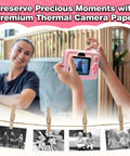 Kids Instant Camera Paper Refill Set 6 Thermal Printing Paper Rolls For Most Kid Cameras White Glossy Photo Paper, hands holding pink kid camera