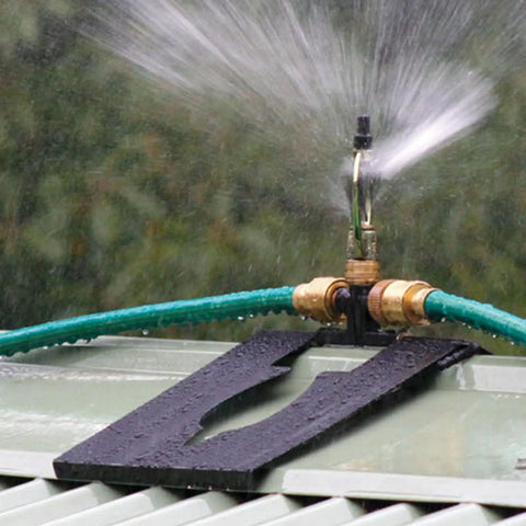 Genuine Real Deal Rooftop Sprinkler System For Wildfire Ember Defense Built Like A Tank With Metal Base and angled spray nozzle.