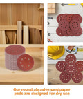 150 Piece Inch 8-Hole Hook And Loop Sanding Discs Assorted Grit Set For Power Tool Grinders stacked on wooden surface.