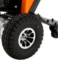 Heavy Duty Electric Powered Tugger With 2,200 Lbs Capacity To Easily Haul Massive Loads Through Tight Spots and Move Gear Around Obstacles Safely Using Precision Controls Plus Emergency Stop and Horn tire close-up, durable tread detail.