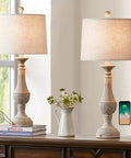 Farmhouse 3 Way Dimmable Touch Table Lamps Set of 2 with USB Ports for Nightstand Living Room and Bedroom Washed White Cozy Rustic Bedside Lamps For Any Room on wooden dresser, with charging phones and touch controls displayed.