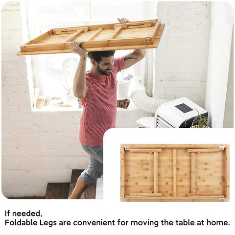 Man carrying Big Floor Desk Tray With Folding Legs, Adjustable Low Coffee Table, bamboo top, shows portability and storage ease.