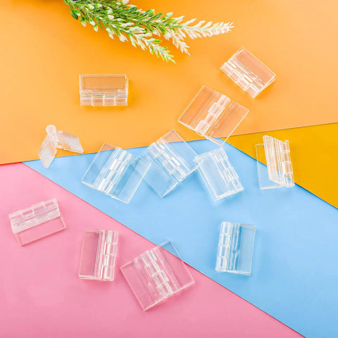 12 Pack Clear Acrylic Hinges Self Adhesive Transparent Piano Strips For Cabinet And Aquarium Lids Straight Up Durable Furniture Hardware No Sweat DIY Setup Smooth Finish 35X30MM on colorful background.