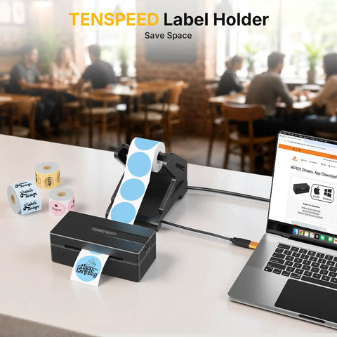 Thermal Label Holder For Rolls And Fan Fold Labels Desktop Label Dispenser For Thermal Printers Office And Home Must Have Wide Compatibility With Roll Labels Up To Four Point Seven Six Inch Wide And Six Inch Outer Diameter Black on desk with laptop