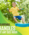 Boy swinging on Kick Stand Up Tree Swing For Backyard And Outdoor Swingsets Kid Friendly Platform Swing With Adjustable Handles