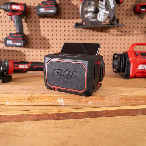 20V Brushless Power Tool Combo Kit With Drill Driver Reciprocating Saw Oscillating Multi Tool Bluetooth Speaker on workbench.