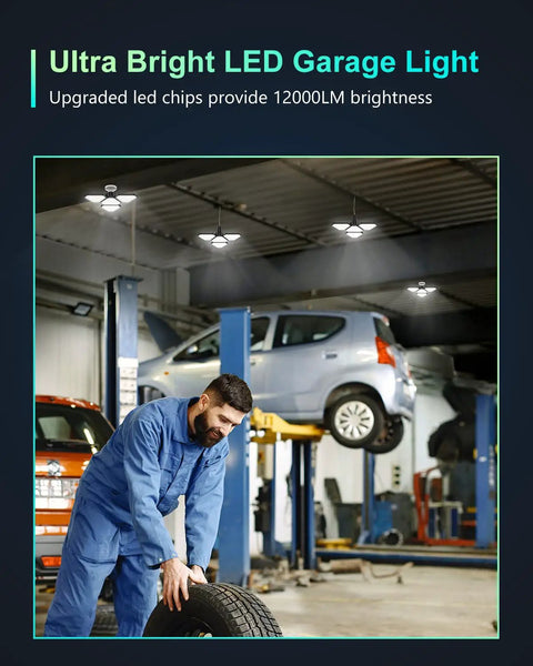 Mechanic working under 120W LED Garage Light 12000LM 6000K With 3 Adjustable Panels in a brightly lit auto workshop