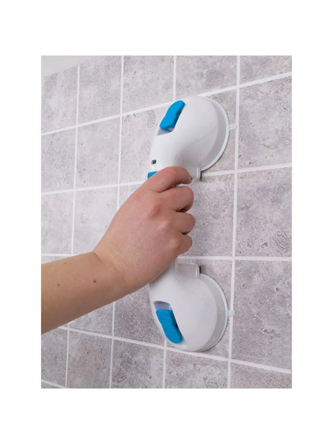 Hand holding 12-Inch Suction Shower Grab Bar with Ultra Grip Dual Locking Cups for strong stability in bathtubs and showers