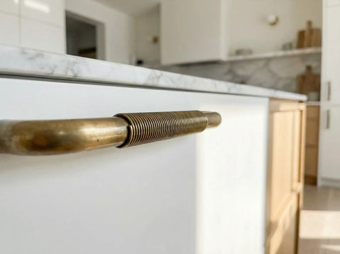 Solid Brass Cabinet Handle With Coiled Wire Grip, Vintage Industrial Style, Antique Brass Finish installed on a kitchen drawer