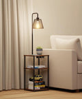 No Fuss All In One Floor Lamp With Table And Shelves Built In Two USB Ports And Outlet beside a couch in a living room.