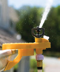 Badass Wildfire Defense Kit With Two Roof Sprinklers And Fifty Foot Hose showing a close-up of a yellow sprinkler mounted on a roof edge.