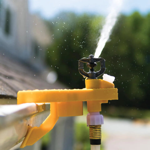 Badass Wildfire Defense Kit With Two Roof Sprinklers And Fifty Foot Hose showing a close-up of a yellow sprinkler mounted on a roof edge.