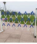 No Sweat Setup Heavy Duty Expandable Metal Barrier With Smooth Roll Wheels, Retractable Mobile Safety Gate, Tough Crowd Control Fence For Garage Jobs And Site Zone Lockdown, blue and white mobile safety gate.