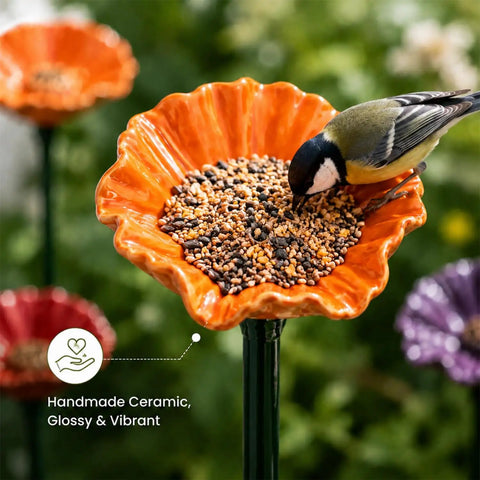 Handmade Ceramic Mini Pollinator Watering Station For Outdoor Gardens with bird feeding on orange flower stake