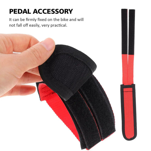 Hand holding Kids Bicycle Toe Clip Straps Set For Easy Install Pedal Footrest Durable Nylon Construction, red and black design.