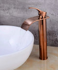 Waterfall Single Lever Vessel Lavatory Basin Tap In Rose Gold Oil Rubbed Bronze Finish next to a white sink