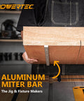 Person holding wooden board with attached Aluminum Miter Bar from Crosscut Sled and Miter Bar Set for Table Saws, 2 Pack.
