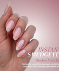Hand with flawless nails demonstrating Instant Smudge Fix For Nails Smooths Dents And Imperfections Quick Dry Top Coat Booster.