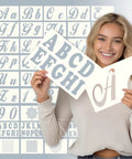 Woman holding Dope 124 Alphabet Numbers Mandala Stencils Set With Large Six Inch And Small Three Inch Pro Grade Reusable Letter Templates