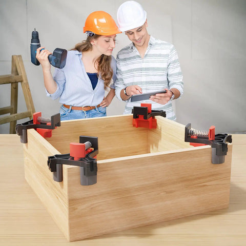 Two people using a Corner Clamp for Woodworking 90 Degree Right Angle Clamp Set Four Pack Adjustable Spring Loaded Wood Clamps