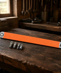 Premium Heavy Duty Offset Extension Wrench Rock Solid High Carbon Steel Construction With Interchangeable Socket Adapter For Tight Spots And Auto Repair displayed on a workbench with adapters.