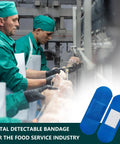 Workers in green uniforms handling food with 100 Pcs Blue Bandages 3 By 1 Inch Metal Detectable Waterproof PE Adhesive Bandages for safety.