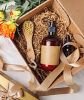 Gift box with 2 Lb Kraft Crinkle Paper Filler Brown Shredded Paper, bottles, brush, ribbon, and flowers