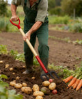 Person using Beefy Heavy Duty Garden Fork With Wooden Handle 4 Tine Pitch Fork For Digging And Compost 45 Inch Long Manganese Steel Head