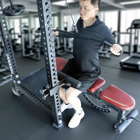 Man using upgrade hamstring curl sit up bar attachments for power racks with pin rod and 3 adjustable holes fits 2x2, 2.37x2.37, 3x3 uprights.